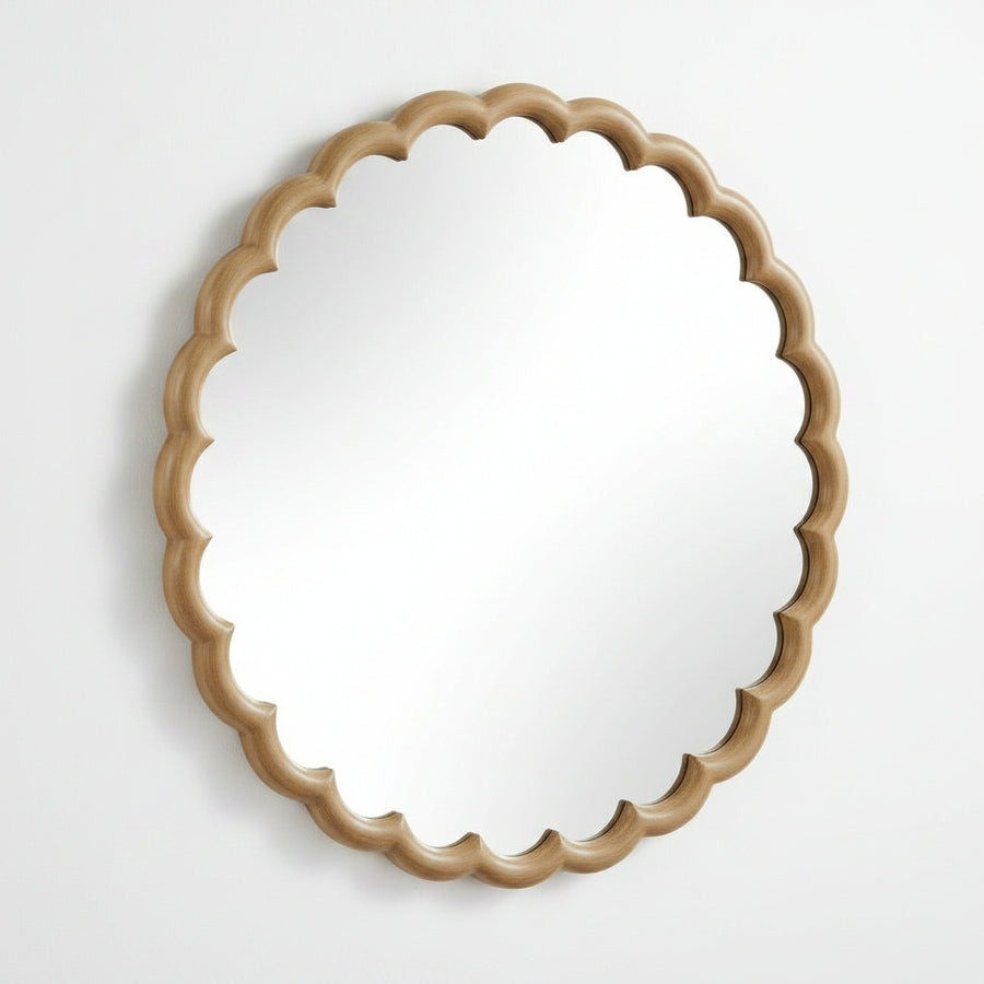 Round mirror with a decorative beige wooden frame on a white background
