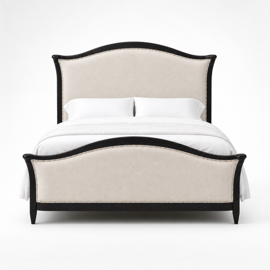 A classic upholstered bed with a curved headboard and matching footboard, featuring a light beige fabric cover and a black wood frame, styled with white bedding and pillows against a plain background.