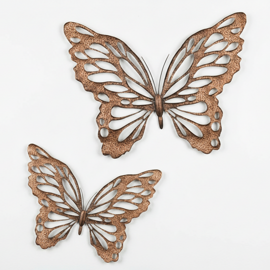 Two copper butterfly wall art pieces on a white background