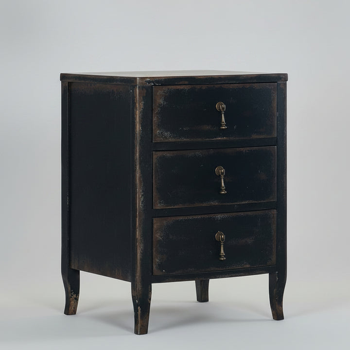 Black distressed dresser with brass handles on a white background