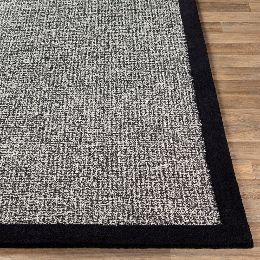 HAND TUFTED WOOL BORDER RUG: BLACK