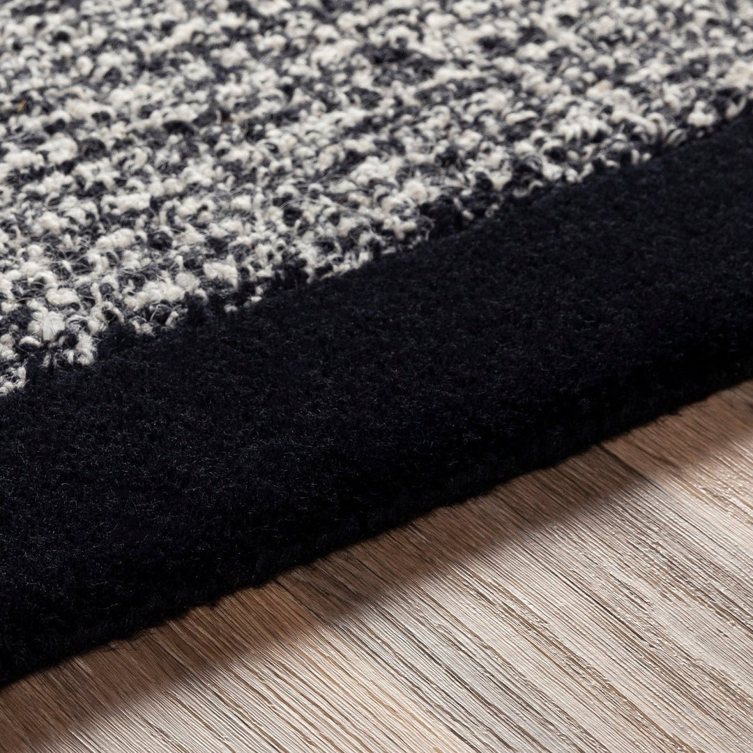 HAND TUFTED WOOL BORDER RUG: BLACK