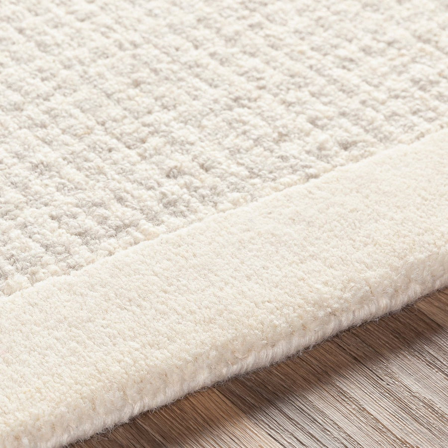 HAND TUFTED WOOL BORDER RUG: CREAM