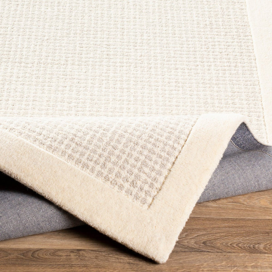 HAND TUFTED WOOL BORDER RUG: CREAM