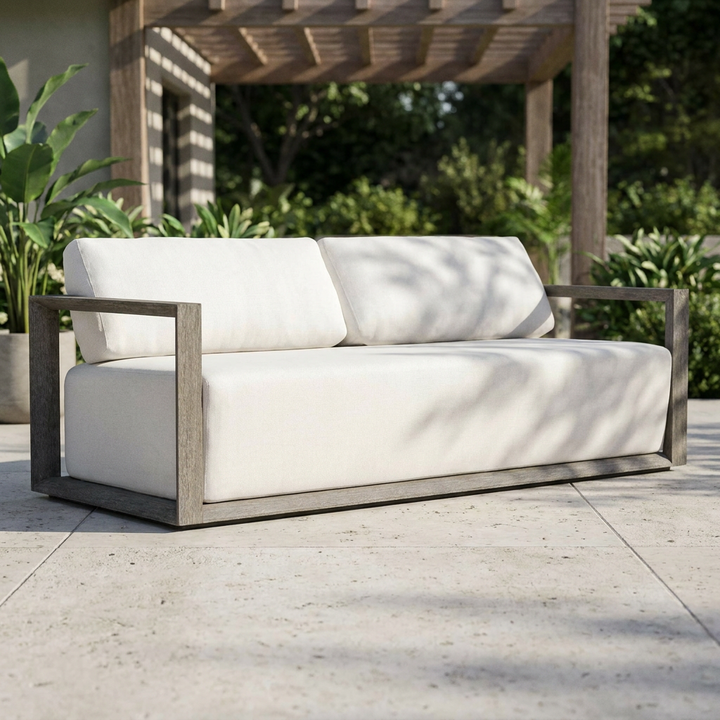 sofa with off-white cushions and a weathered gray-brown wooden frame