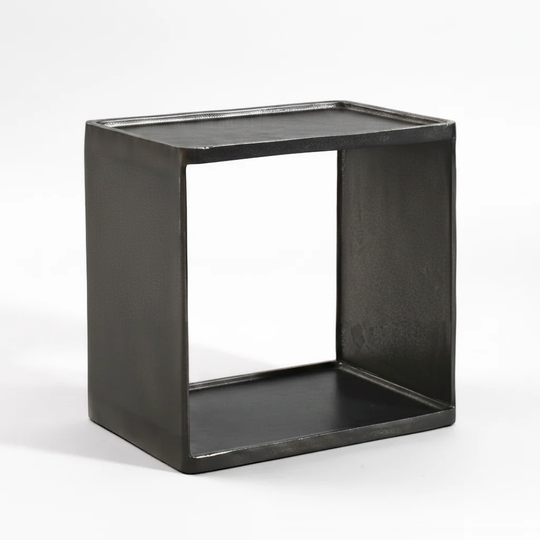 A rustic black metal cube side table with an open center, photographed on a seamless white background.
