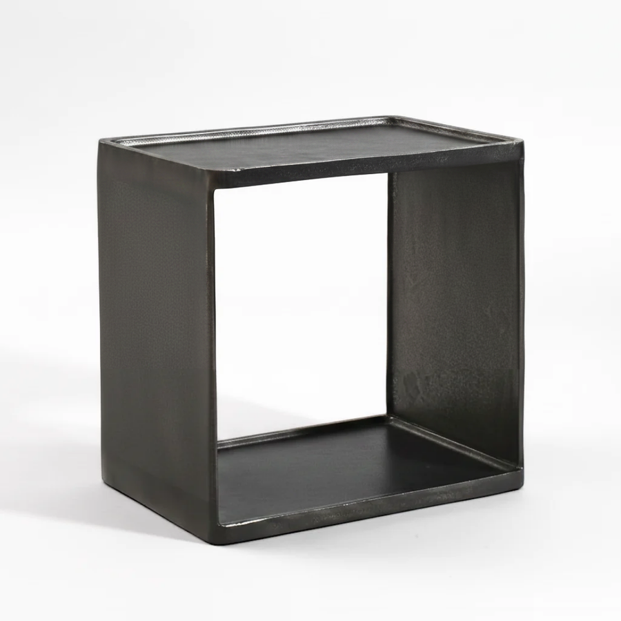 A rustic black metal cube side table with an open center, photographed on a seamless white background.