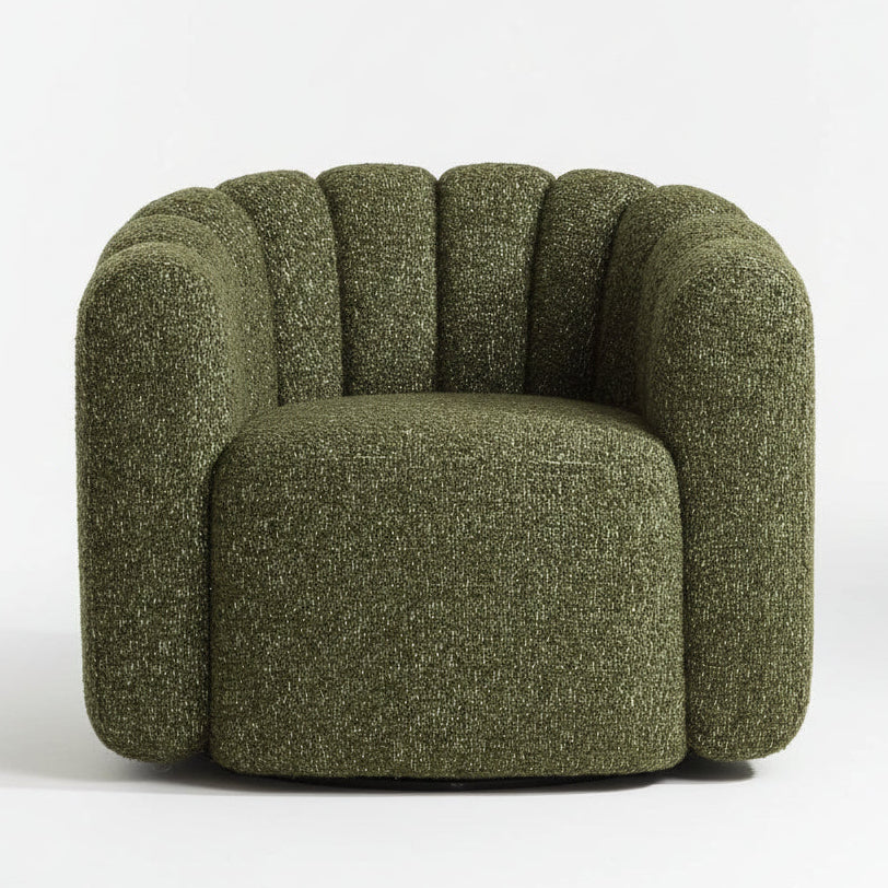 Green textured armchair on a wooden floor with a neutral background
