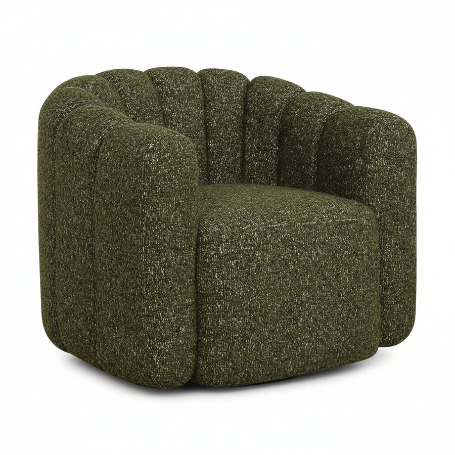 Green textured armchair armchair in a minimalistic room with wooden floor and white walls