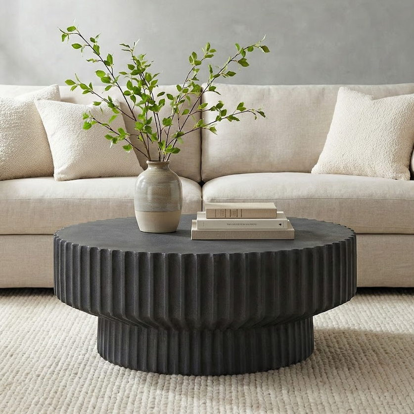 Black textured round coffee table on a white background