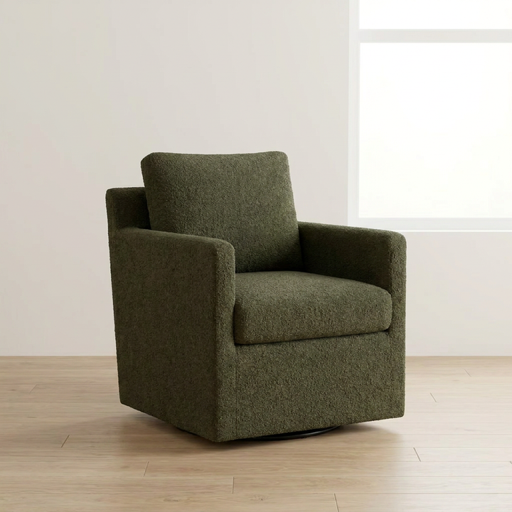 armchair on a wooden floor with a white wall background