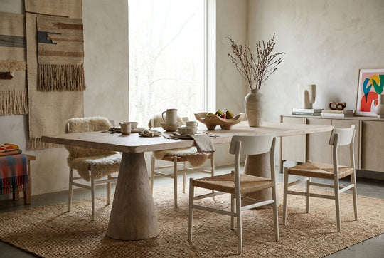 light wooden table with a rectangular top and two tapered conical legs isolated