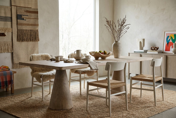 light wooden table with a rectangular top and two tapered conical legs isolated
