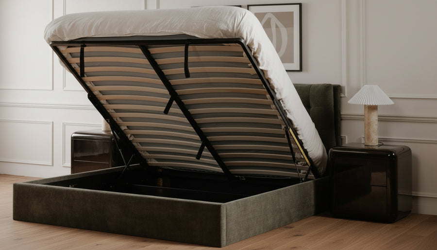 Dark green bed with open storage compartment in a room setting