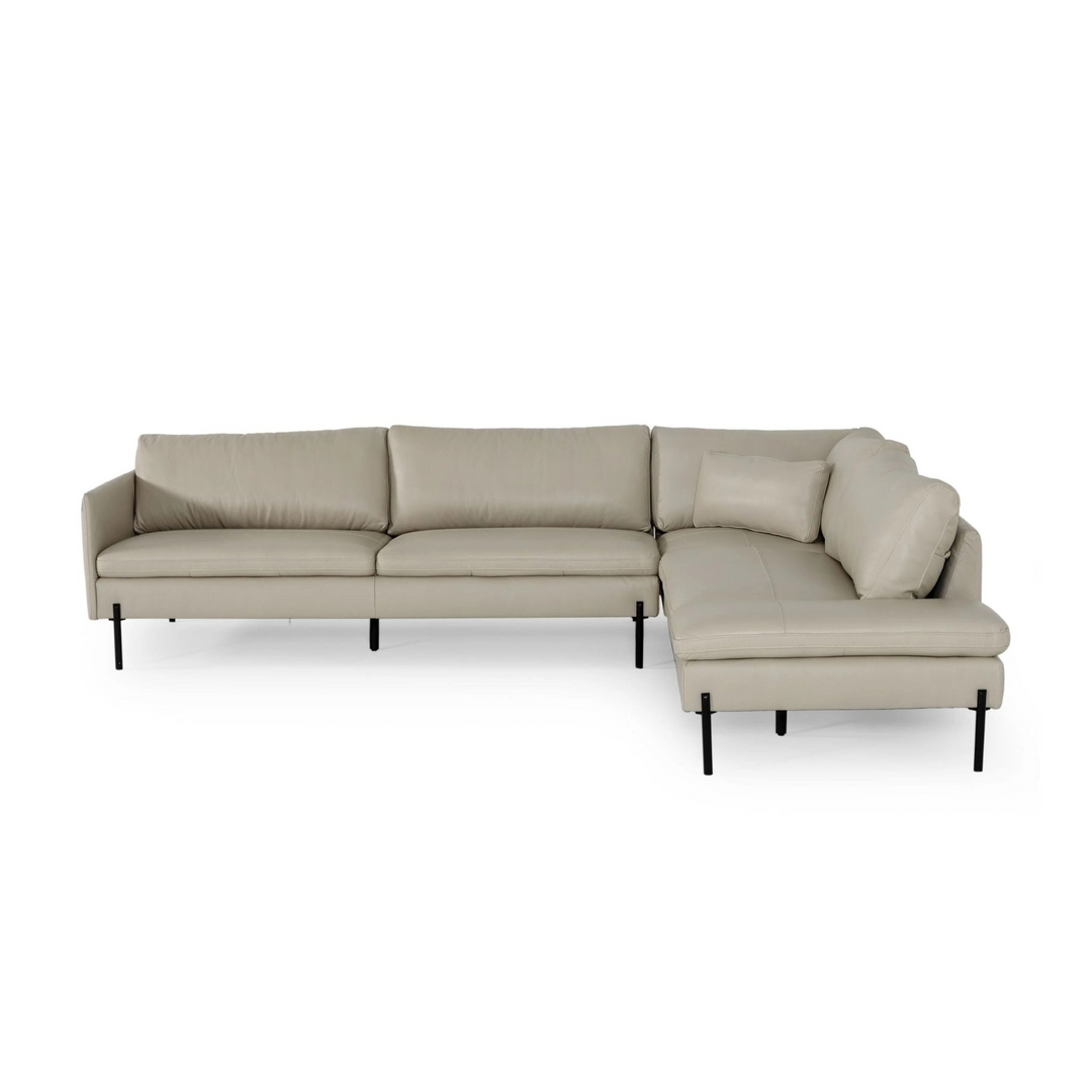 Modern beige leather sectional sofa with black metal legs, featuring clean lines and plush cushions.