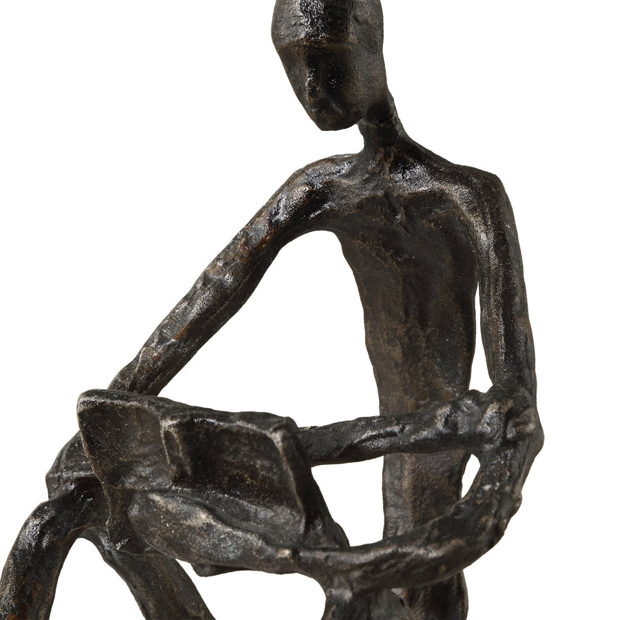 SIT BACK, RELAX AND READ, IRON SCULPTURE