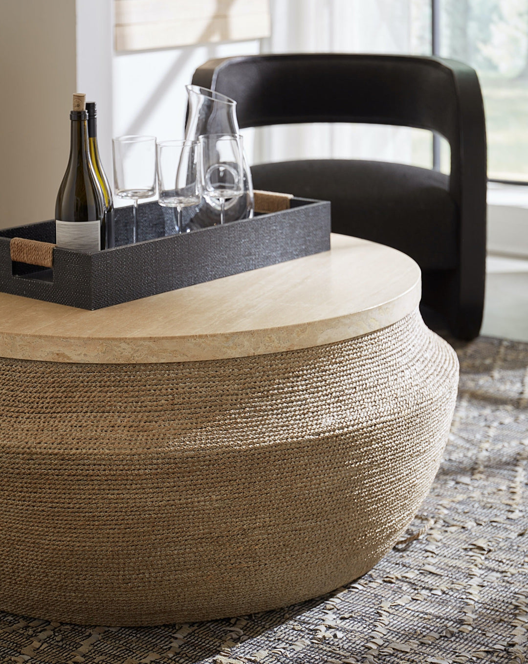 ROPED ROUND TRAVERTINE TOP COCKTAIL TABLE