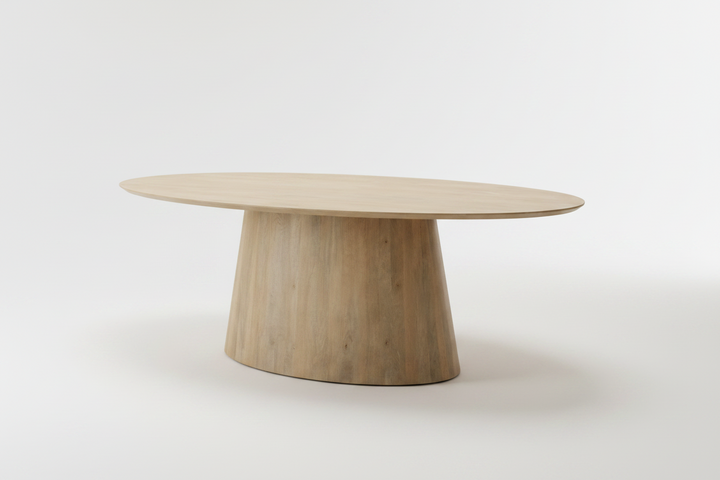 An oval wooden dining table with a tapered, rounded pedestal base, shown on a clean white studio background.